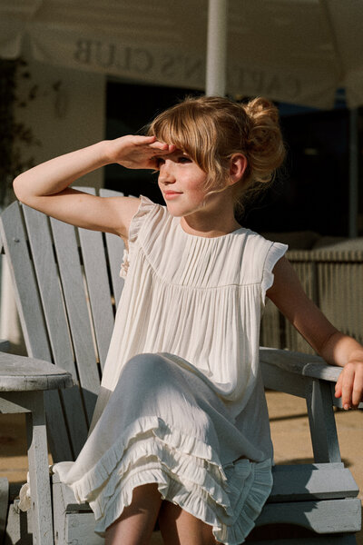 girl sitting on chair